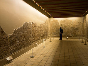 Examining wall reliefs